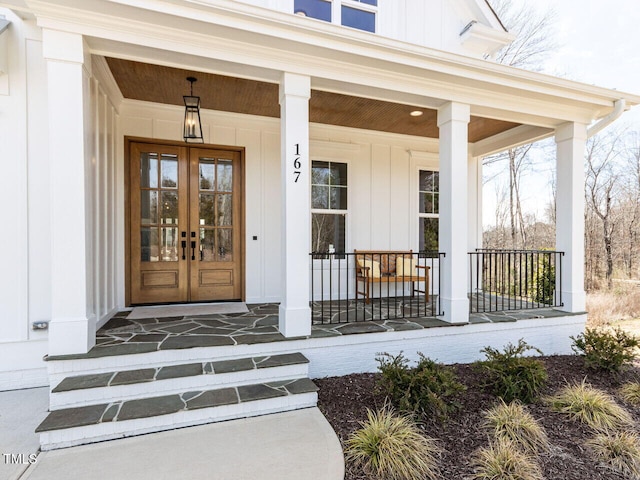 entrance to property featuring board and batten siding and french doors