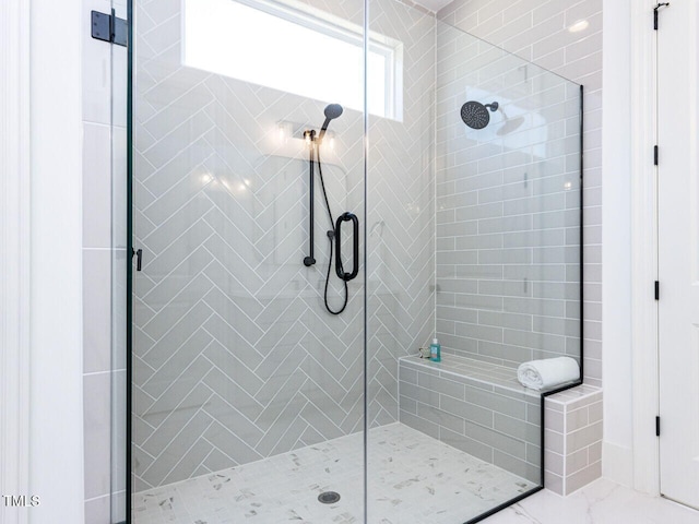 bathroom with a shower stall