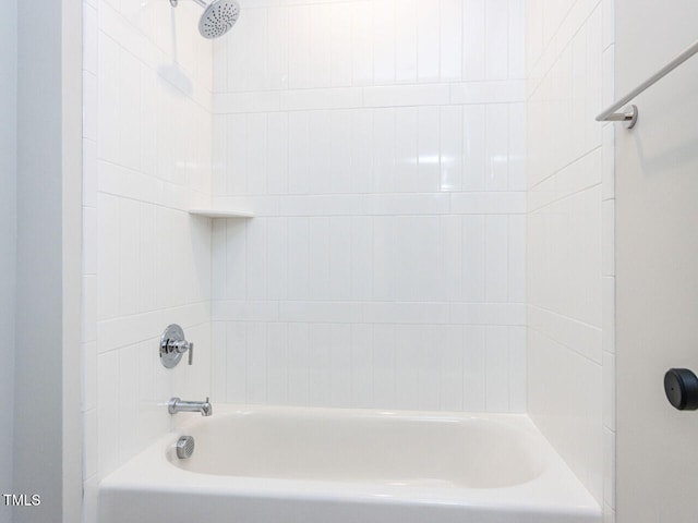 bathroom with washtub / shower combination