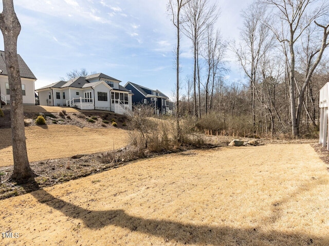 view of yard featuring a sunroom