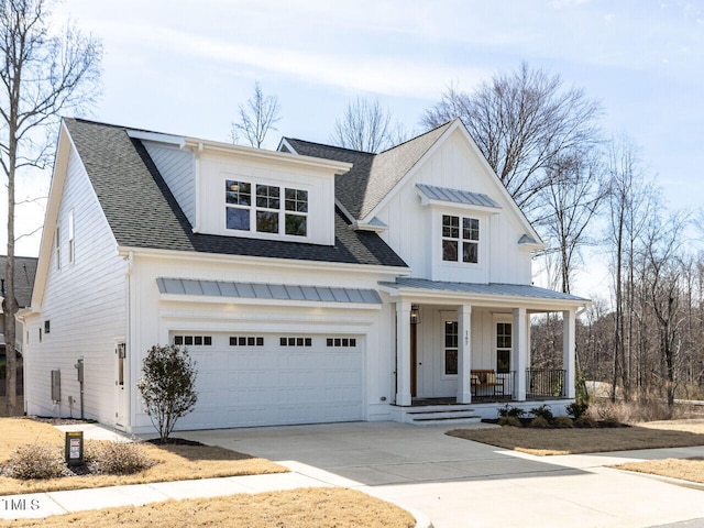 modern inspired farmhouse featuring a standing seam roof, covered porch, driveway, roof with shingles, and board and batten siding