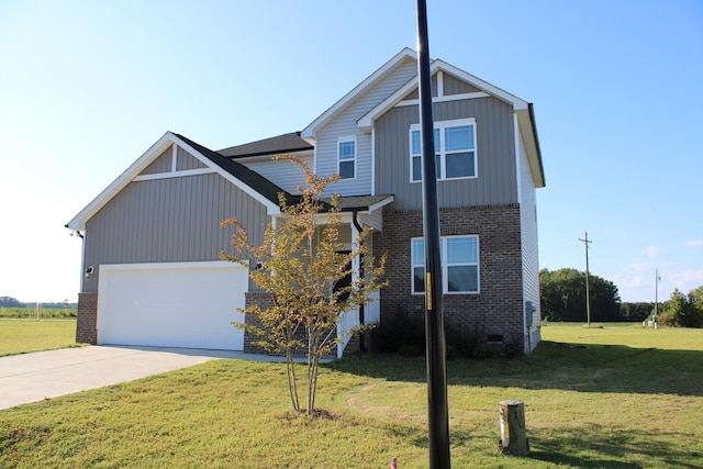 view of front of property featuring a front lawn and a garage