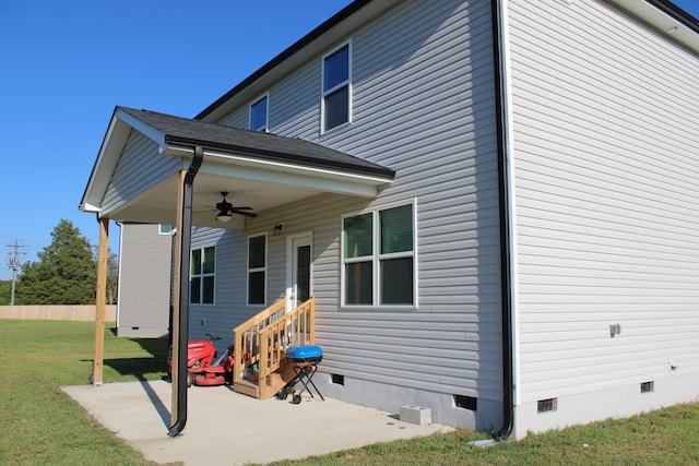 exterior space featuring a yard, ceiling fan, and a patio