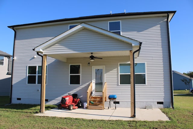 back of house featuring a yard, ceiling fan, and a patio area