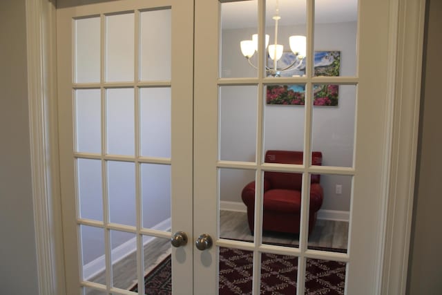 room details featuring a chandelier and french doors