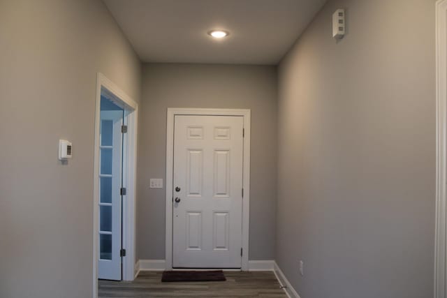 doorway to outside featuring dark hardwood / wood-style flooring