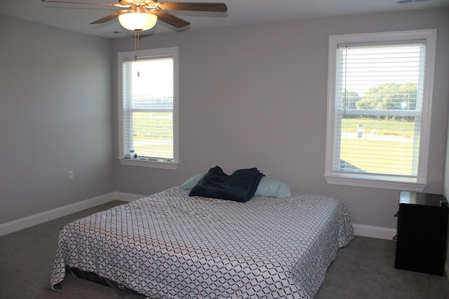 carpeted bedroom with ceiling fan