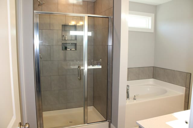 bathroom featuring plus walk in shower