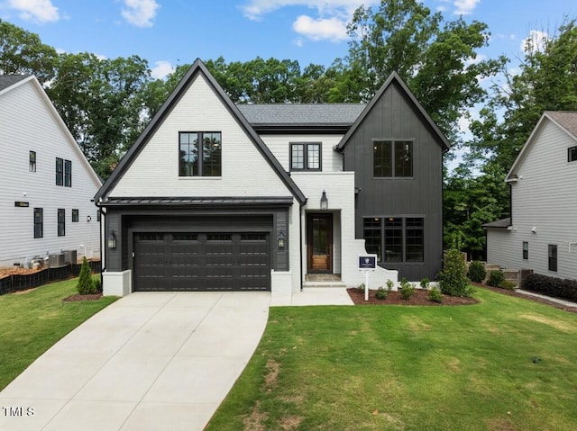 modern farmhouse style home featuring a garage and a front yard