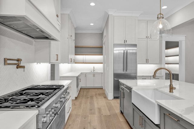 kitchen featuring hanging light fixtures, custom exhaust hood, backsplash, and ornamental molding