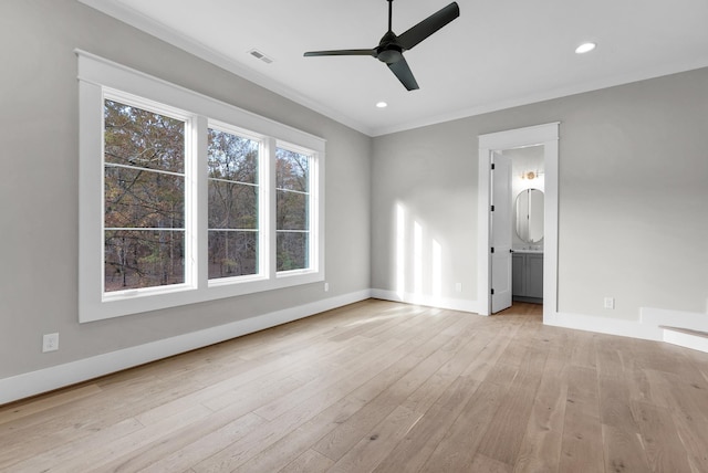 unfurnished bedroom featuring ensuite bathroom, ceiling fan, light wood-type flooring, and crown molding