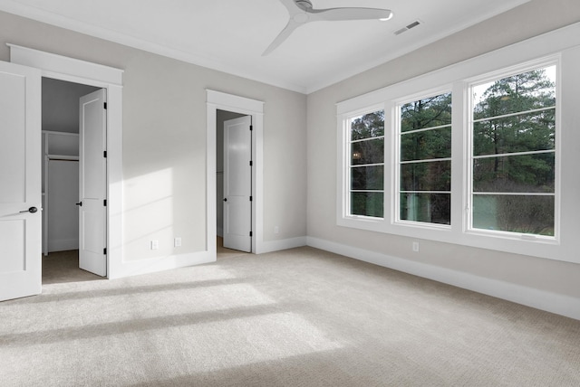 unfurnished bedroom featuring light carpet and ceiling fan