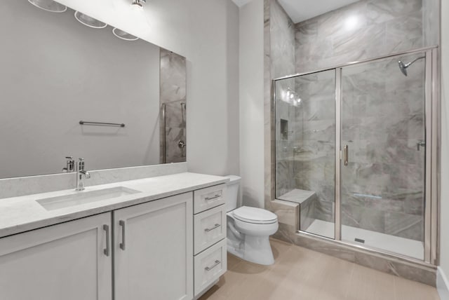 bathroom featuring walk in shower, tile flooring, toilet, and vanity