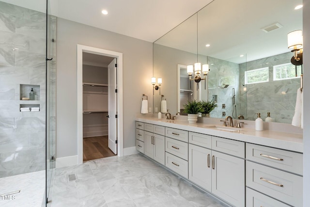 bathroom with vanity and an enclosed shower