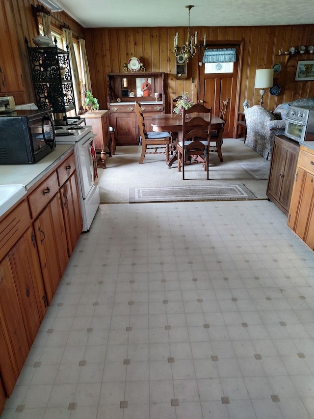 interior space featuring light tile flooring, a chandelier, and wooden walls