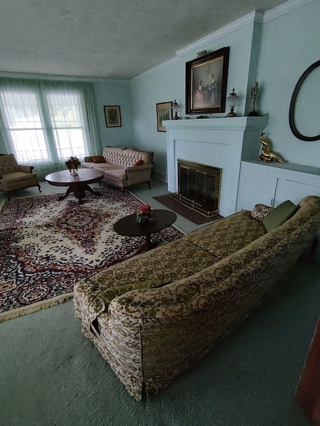 living room featuring carpet flooring, a tile fireplace, and a textured ceiling