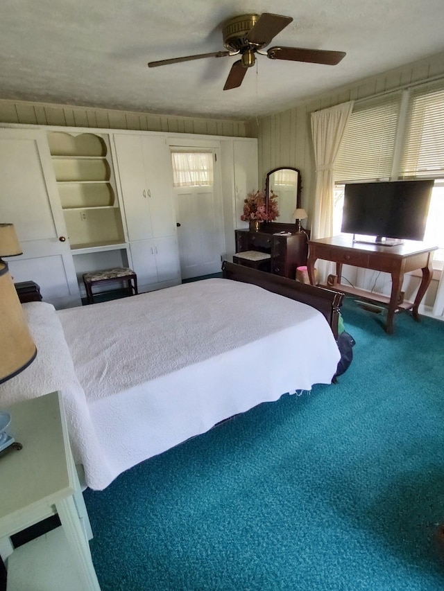 carpeted bedroom with ceiling fan