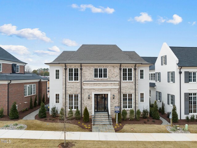 view of front of home with a front yard