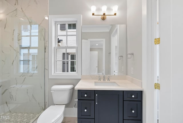 bathroom with a shower with door, vanity, toilet, and ornamental molding