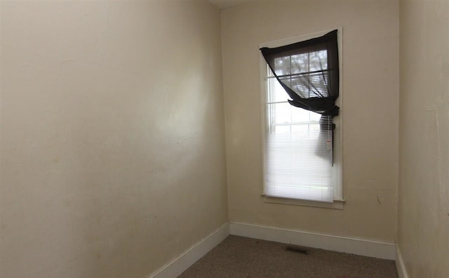 spare room featuring carpet flooring