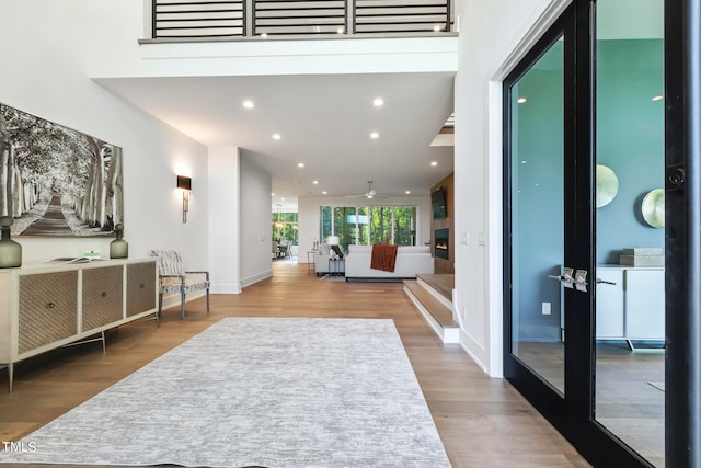 entrance foyer featuring recessed lighting, ceiling fan, baseboards, and wood finished floors