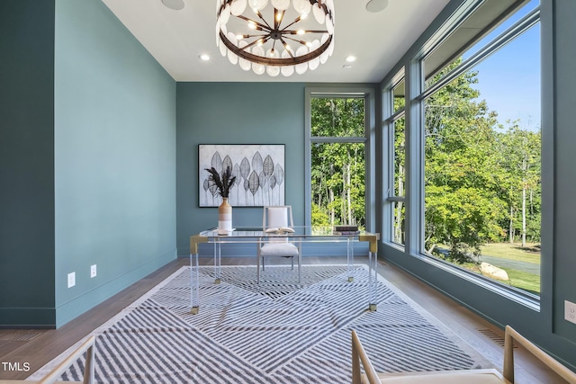 home office featuring visible vents, baseboards, recessed lighting, an inviting chandelier, and wood finished floors