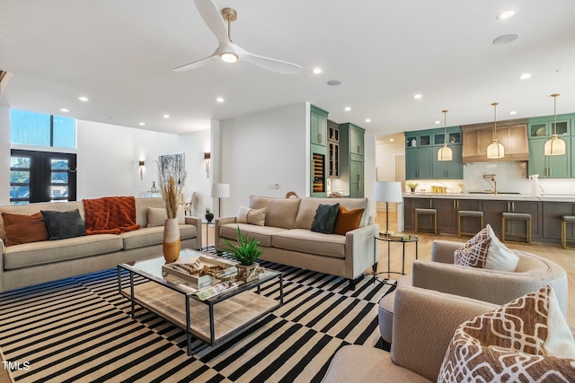 living room with ceiling fan and recessed lighting