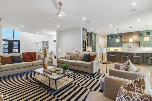 living room with a ceiling fan and recessed lighting