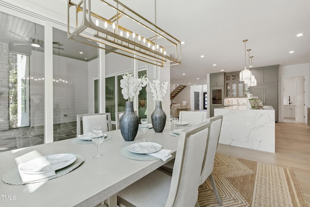 dining space featuring a ceiling fan, recessed lighting, and light wood-type flooring