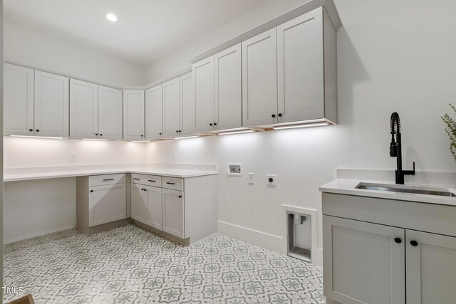 laundry room featuring recessed lighting, washer hookup, a sink, cabinet space, and electric dryer hookup