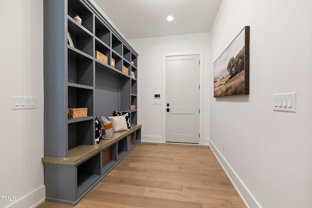 mudroom featuring recessed lighting, baseboards, and light wood finished floors