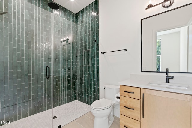 bathroom with a stall shower, tile patterned flooring, vanity, and toilet