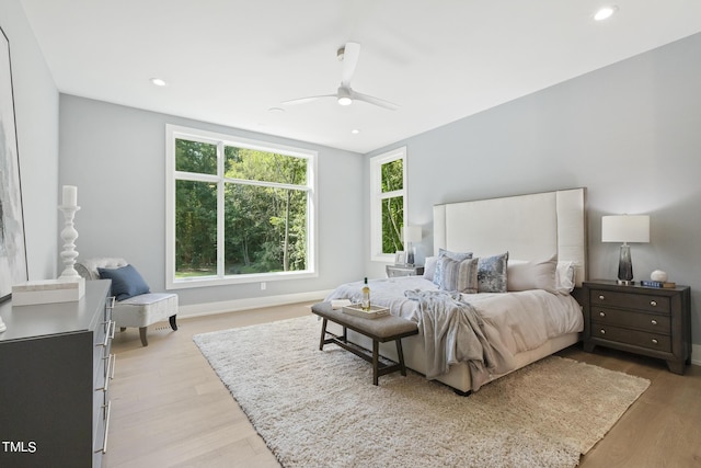 bedroom with recessed lighting, light wood-type flooring, and a ceiling fan