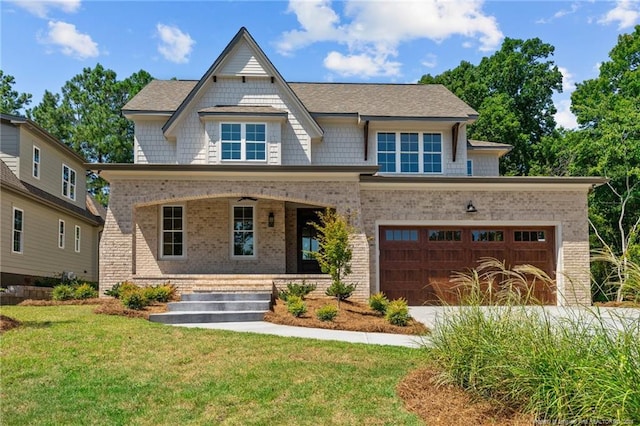 view of front of house featuring a front lawn and a garage