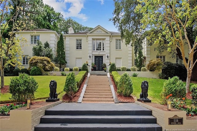 back of house featuring a yard