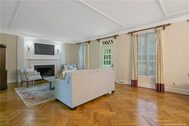 living room with crown molding and light parquet floors