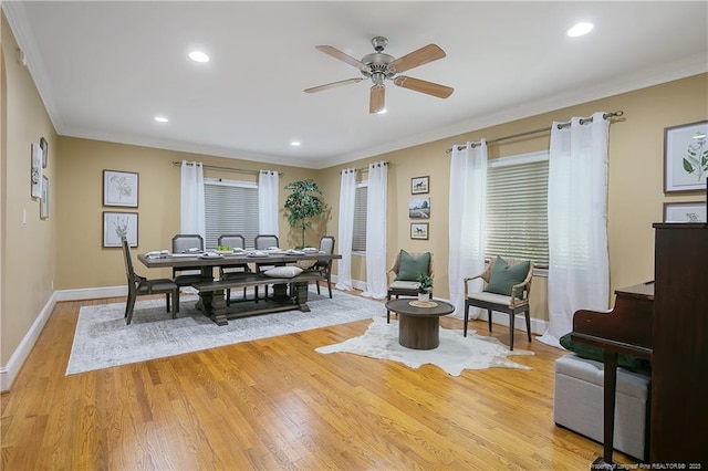 dining room featuring ceiling fan, ornamental molding, and light hardwood / wood-style floors