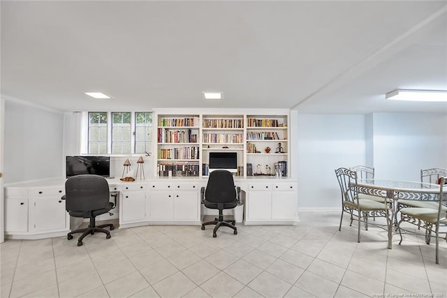 office space with light tile flooring