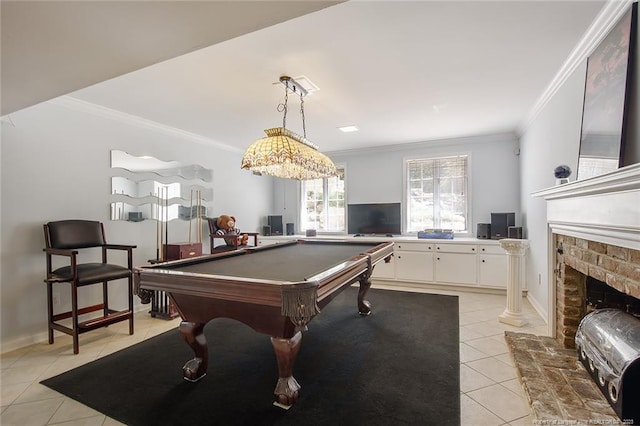 game room featuring crown molding, a brick fireplace, billiards, and light tile floors