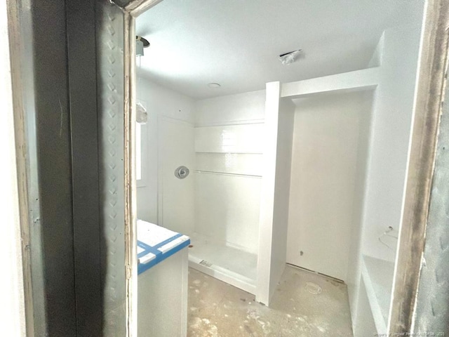 bathroom featuring concrete floors