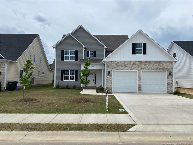 view of front facade featuring a front yard and a garage