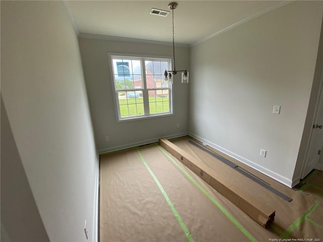 unfurnished dining area with ornamental molding