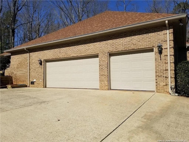 garage featuring driveway