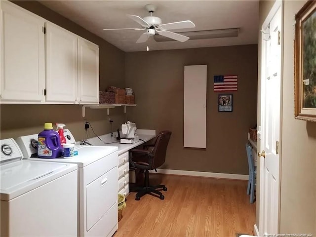laundry room featuring a ceiling fan, baseboards, separate washer and dryer, light wood-style flooring, and cabinet space