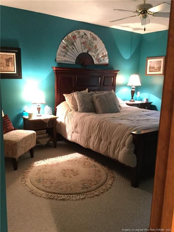 bedroom with carpet floors and a ceiling fan