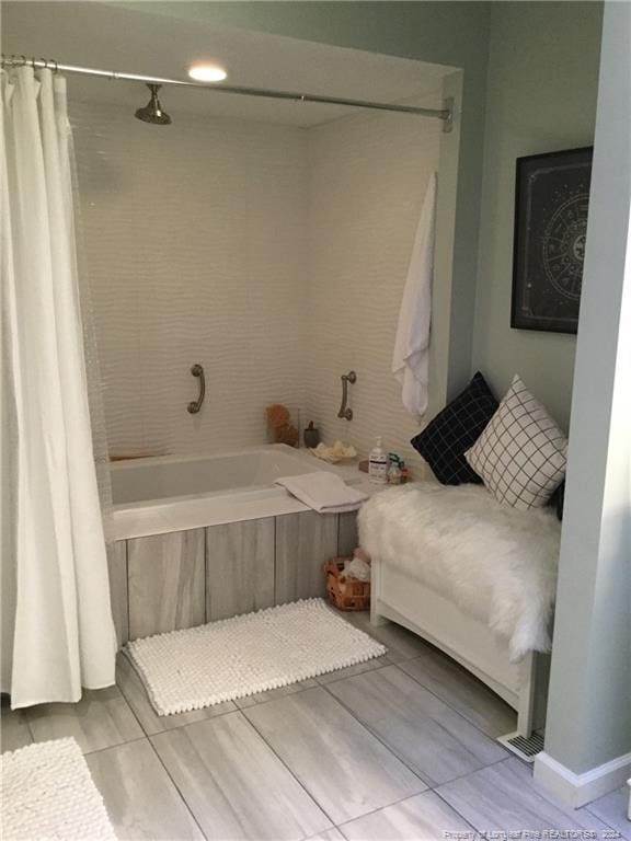 bathroom featuring shower / bathtub combination with curtain