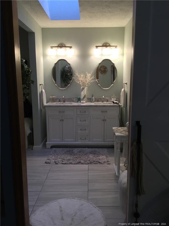 bathroom with double vanity and a sink