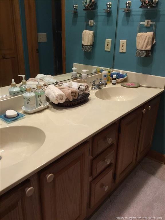 bathroom with double vanity and a sink