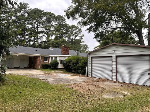 garage with a yard