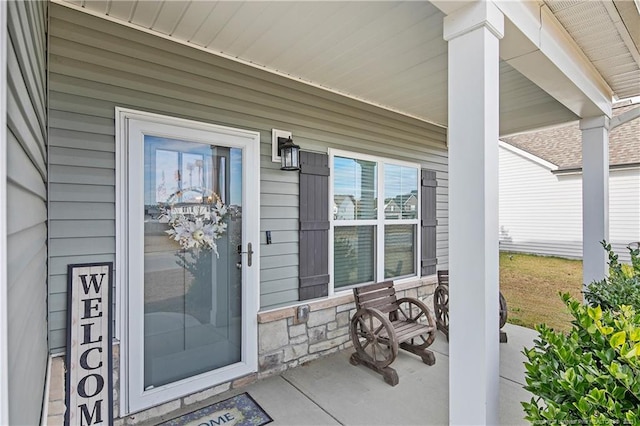 property entrance featuring a porch